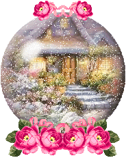 A snow globe with a cottage in the snow, on pink roses