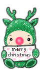 A little one in a green reindeer suit holding a Merry Christmas sign