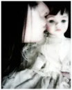 Girl Kissing Doll