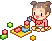 mini girl playing blocks
