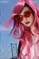 Audrey Kitching  with pink sunglasses
