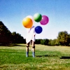 Girl with colorful balloons