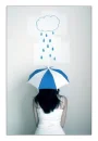 girl under paper rain