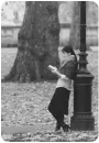 girl reading a book in a park