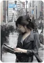 girl reading the newspaper in the streets