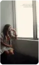 girl looking through the window