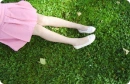 girl laying on the grass