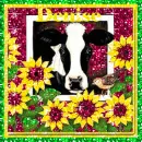 cow in a barn with sunflowers around it