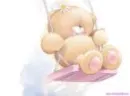 bear sitting on a swing
