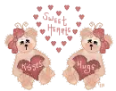 two teddy bears holding hearts