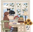 girl sitting at computer with cat