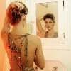 girl looking into mirror