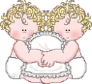 two babies hugging pillow