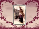 woman staring at a castle in a bevelled frame, surrounded by heartshaped vines