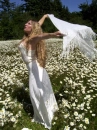 GIRL IN FIELD OF DAISIES
