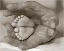 daddy hands and baby feet