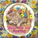 cat sleeping in a basket with flowers