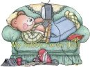 bear napping on couch with remote and tv