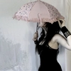 Girl holding umbrella