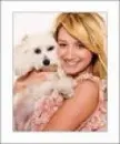 Ashley Tisdale hugging her dog