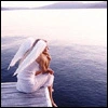 Angel sitting by water