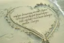 love letter in sand