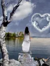 Woman looking at heart cloud