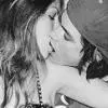 a girl kissing a boy
