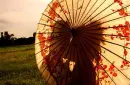 kiss under umbrella