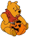 Pooh carving a pumpkin