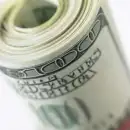 100 dollar bills rolled