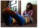 sad girl with rainbow socks