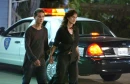 (walkin by a police car)