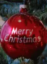 merry christmas ornament in tree