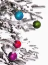 snowy christmas tree and ornaments