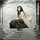 angel at pond of water