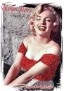 MARILYN MONROE SMILING AND SITTING.