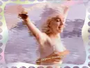 MARILYN RUNNING ON BEACH WAVING HER SCARF.