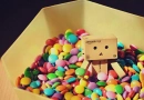 Box dude in vat of M&M's