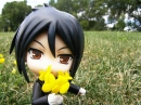 Doll Smelling Flowers