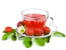 Tea with a strawberry