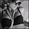 Bra, pearls, and sunglasses
