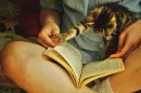 girl playing with cats