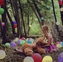girl holding teddy bear