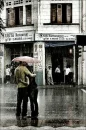 cute couple hugging in the rain