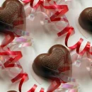 Chocolate hearts and ribbons seamless background