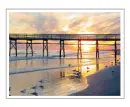 Wharf at a beach with a sunset