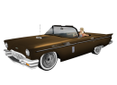 Blonde girl driving vintage Ford Thunderbird