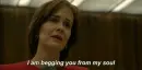 woman saying "I'm begging you from my soul"