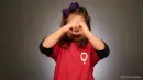 girl making a heart with hands